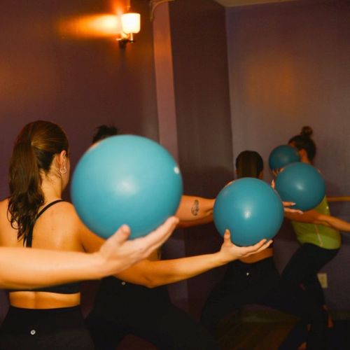 Barre Fitness class with medicine balls